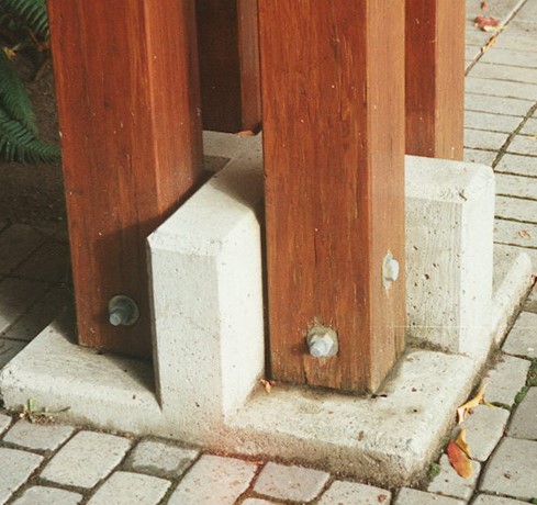 Figure 2 left: Water damage at the base of wooden columns