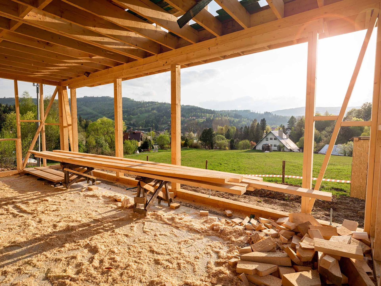 Timber frame structure open to the mountains